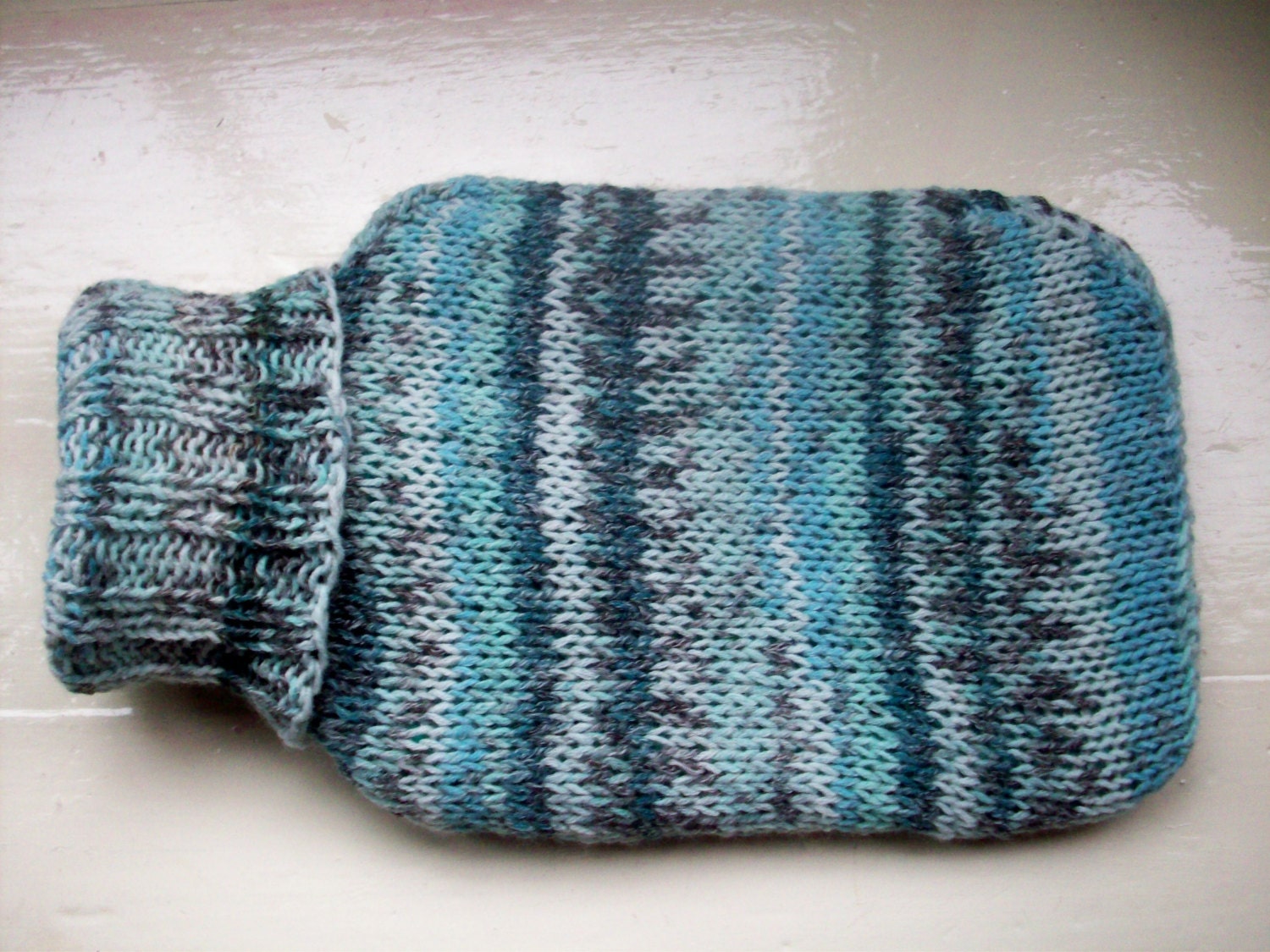Hot water bottle and cover hand knitted cozy medium soft warm Fair Isle effect aqua