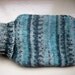 Hot water bottle and cover hand knitted cozy medium soft warm Fair Isle effect aqua
