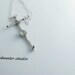 off kilter sterling silver hand forged cross with calcedony stone and sterling silver chain