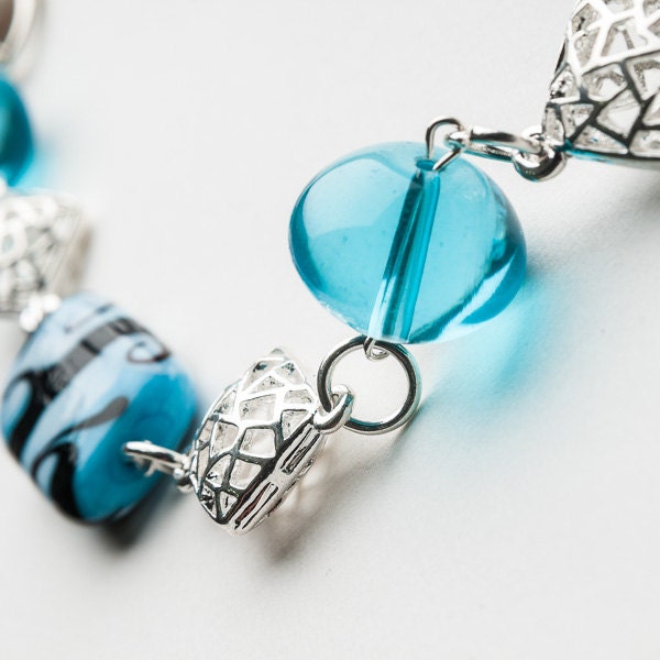 Chunky aqua glass statement necklace with cream jersey tie