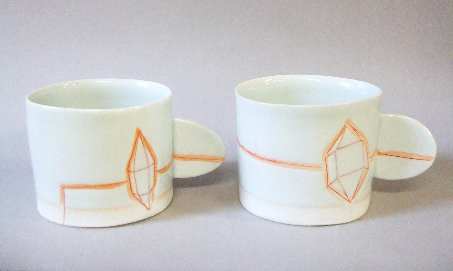 2 espresso cups with translucent bottom