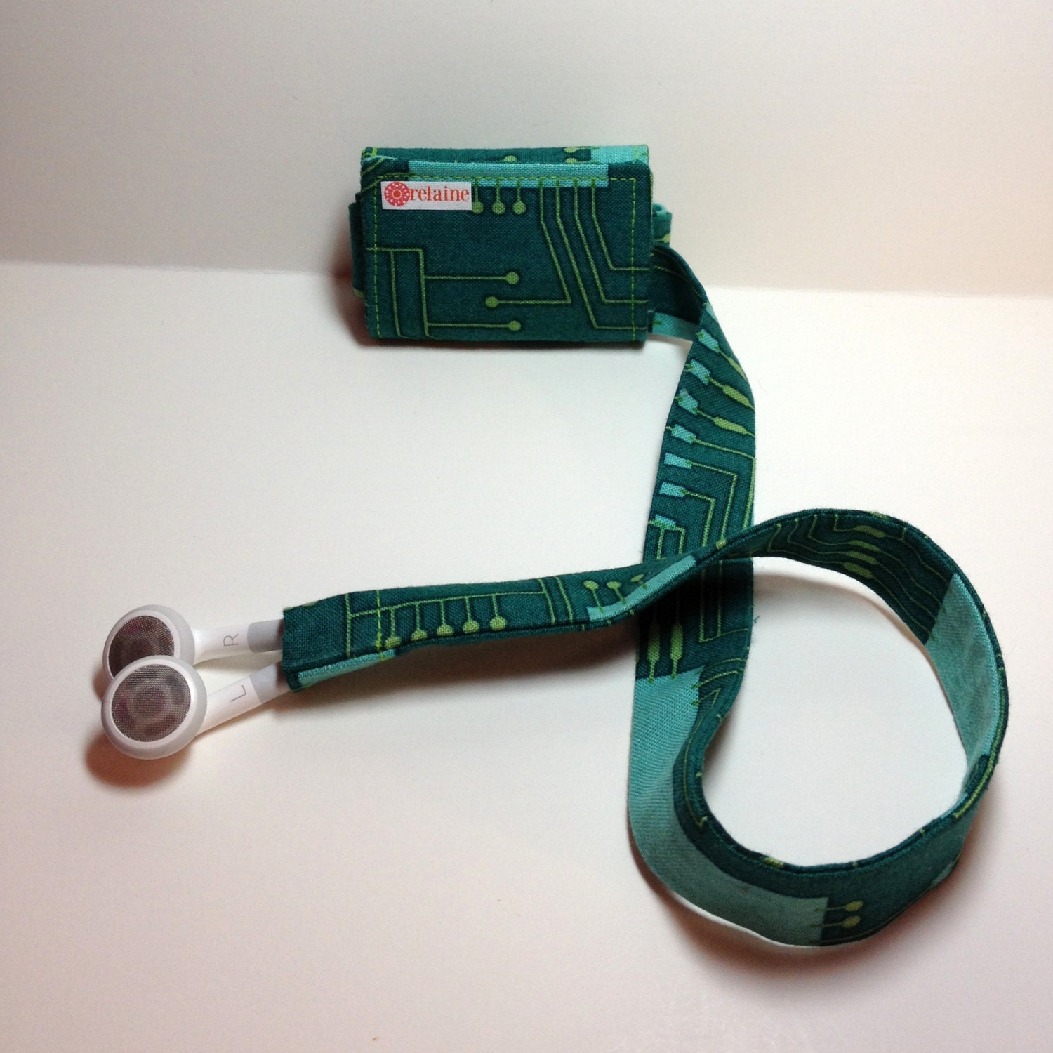 Circuit TuneTube.  Earbud cord organizer for iPhone or iPod.  Cord keeper.  Earbud holder.  Earbud case.