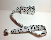 Music notes TuneTube.  Earbud cord organizer for iPhone or iPod.  Cord keeper.  Earbud holder.  Earbud case.