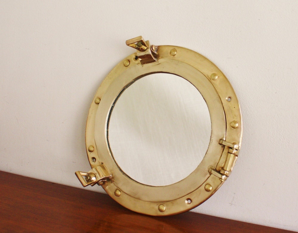 Round brass porthole style mirror