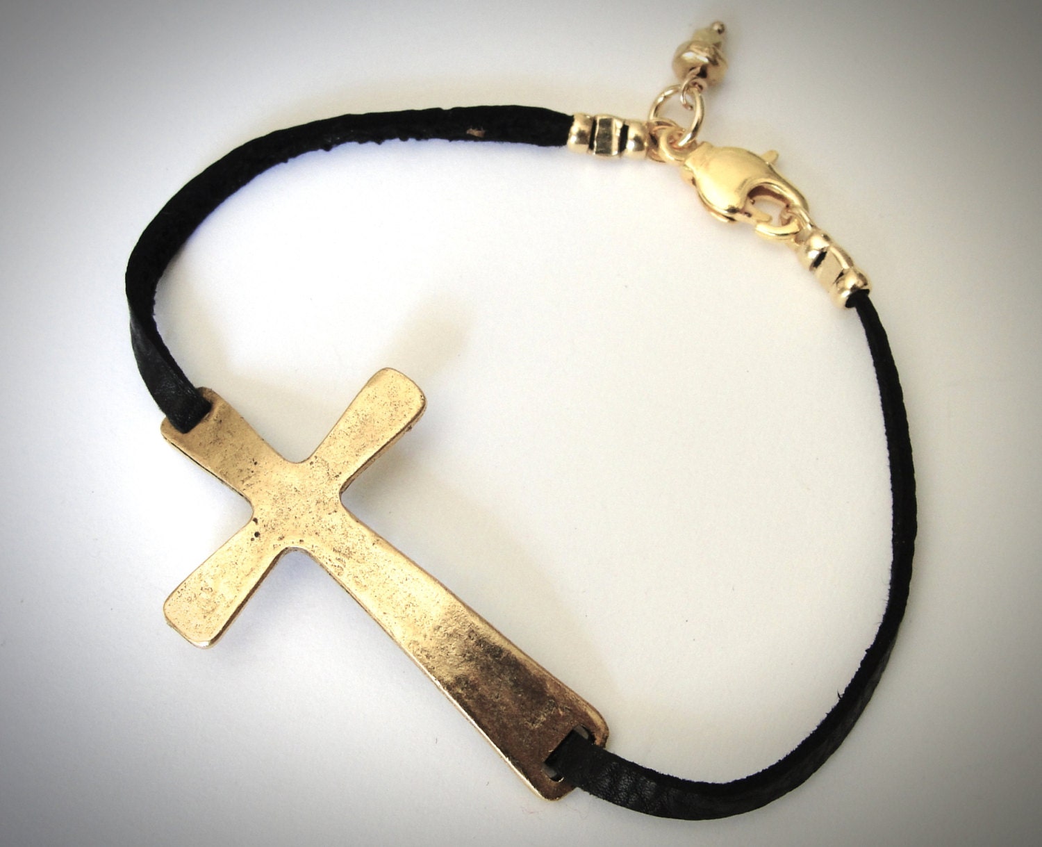 NEW - Sideways Cross in Gold Pewter on Black Leather bracelet