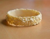 Vintage 20s 30s deco carved molded plastic celluloid bangle, flowers, roses, daisy