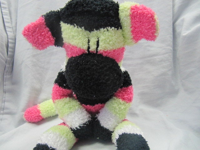 Suzie a lime green, hot pink, black and white striped fuzzy plush sock monkey (a)