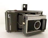 Vintage Polaroid Electric Eye Land Camera model J66 with leather carrying case and instructions