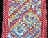 Scrappy Trip Around the World Patchwork Quilt.
