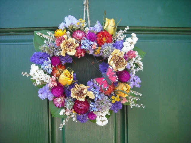 Small Handmade colorful spring dried flower garden wreath with butterfly. A sweet Mother's day gift.