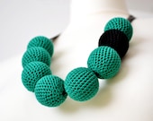 emerald green textile big crochet bead necklace with one black bead in urban style, whimsical, bold, boho style, gift for her
