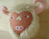 Fuzzy monster ornament, tan and pink