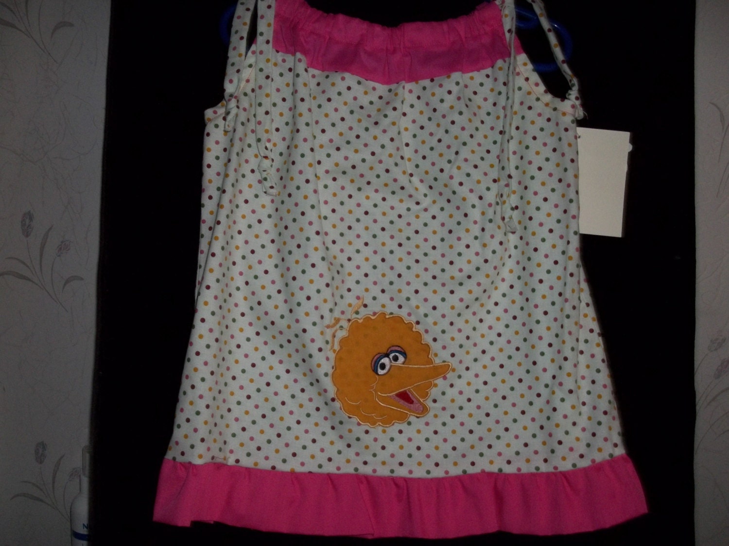 multi colored dot pillowcase dress with hot pink accents in a size 3/4