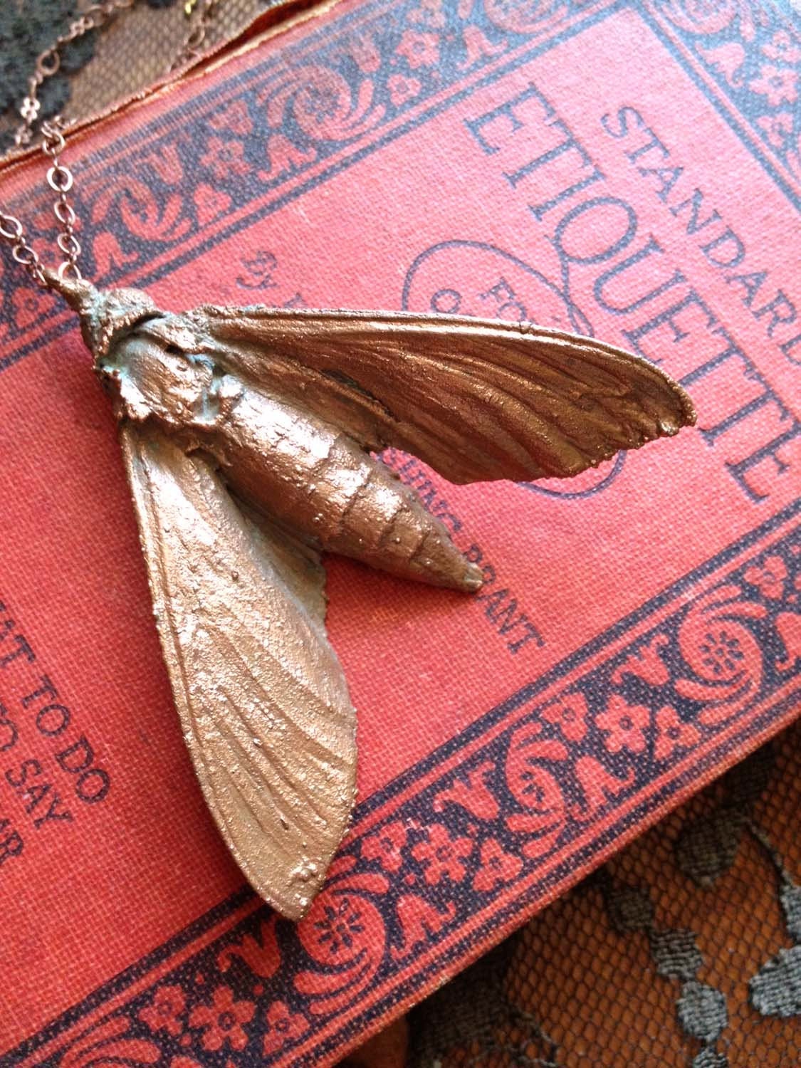 copper plated sphinx moth necklace (made from a real moth)