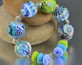 SPRING MEADOW - Set of 12 Round Lampwork Beads - dot petal beads - green periwinkle navy blue violet lavender - SRA Handmade Glass Beads