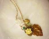 Autumn Love necklace made with vintage leaf charm, heart lockets, rose lace, crystals etc.