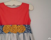 Coral cotton dress with mustard and navy sash