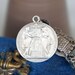 Antique Assemblage Necklace with 19th Century French Silver Marriage Medal Garnets and Moss Aquamarine