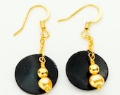 Gold-tone mother of pearl earrings in black and gold