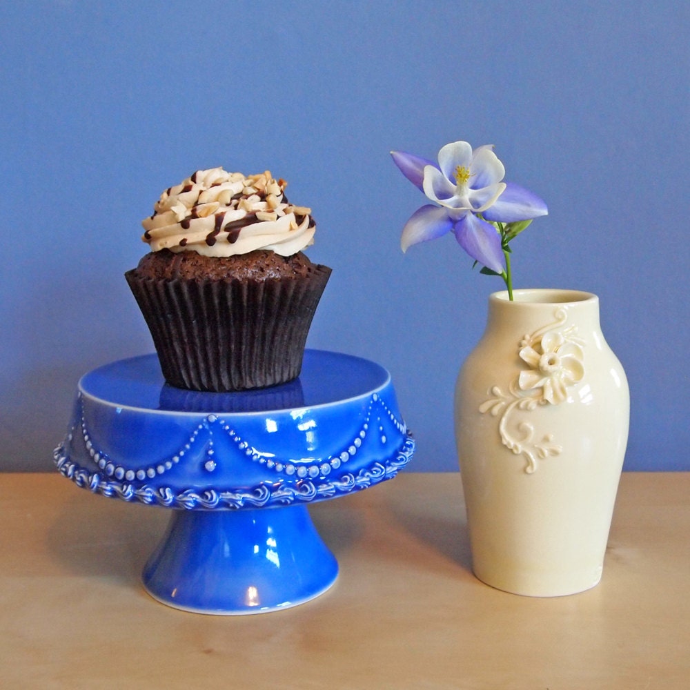 cupcake stand in delphinium with string of pearls