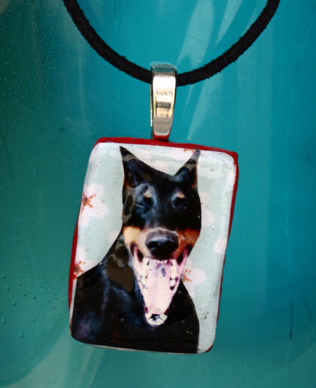 Laughing Dog Necklace, paper clay and photo, doberman, corded, blue and red, whimsical, black dog