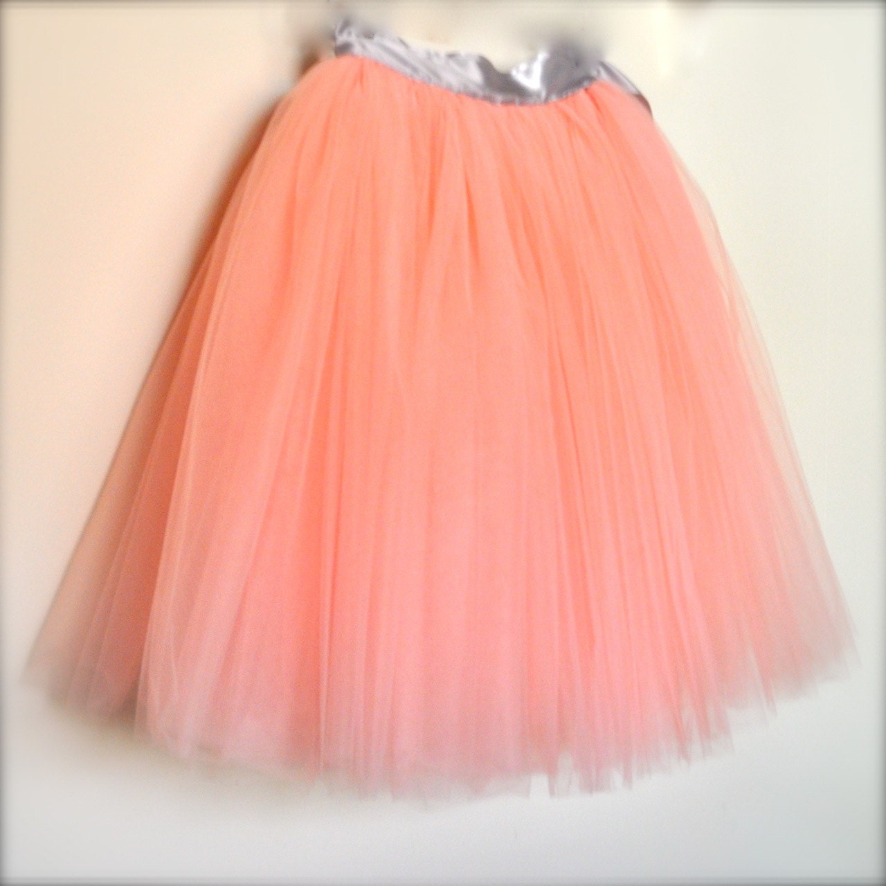 Vintage pink tulle skirt with satin ribbon sashed adult tutu. Romantic tea length.