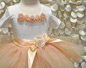 Champagne fluffy tutu with satin ribboned waist. Featured in Martha Stewart Weddings Magazine Spring 2011.