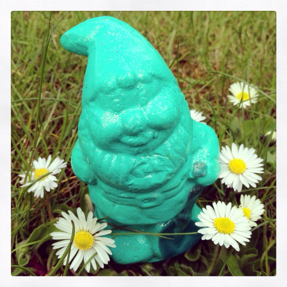 Kitsch decorative teal green mini gnome ornament for garden or home decoration.
