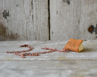 Book necklace: OOAK Miss, postcard early 1900s, leather, letters, medium.