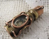 Steampunk USB flash drive with glowing glass windows. 32 GIG. Copper, brass, watch parts and glass. Waterproof.