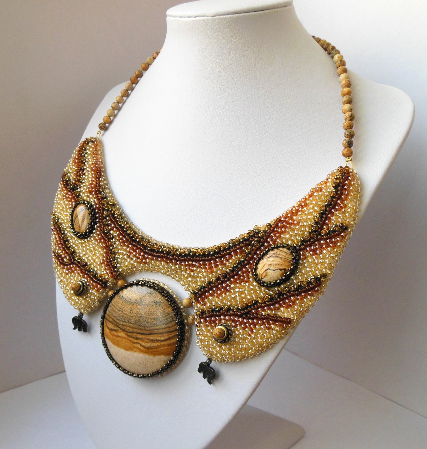 Embroidery beads necklace "Two Elephants" with landscape jasper sandy brown