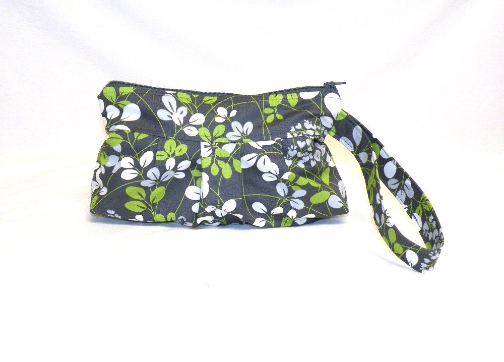 Pleated Wristlet in leaf pattern in shades of kelly green, dove grey, and cream on dark grey