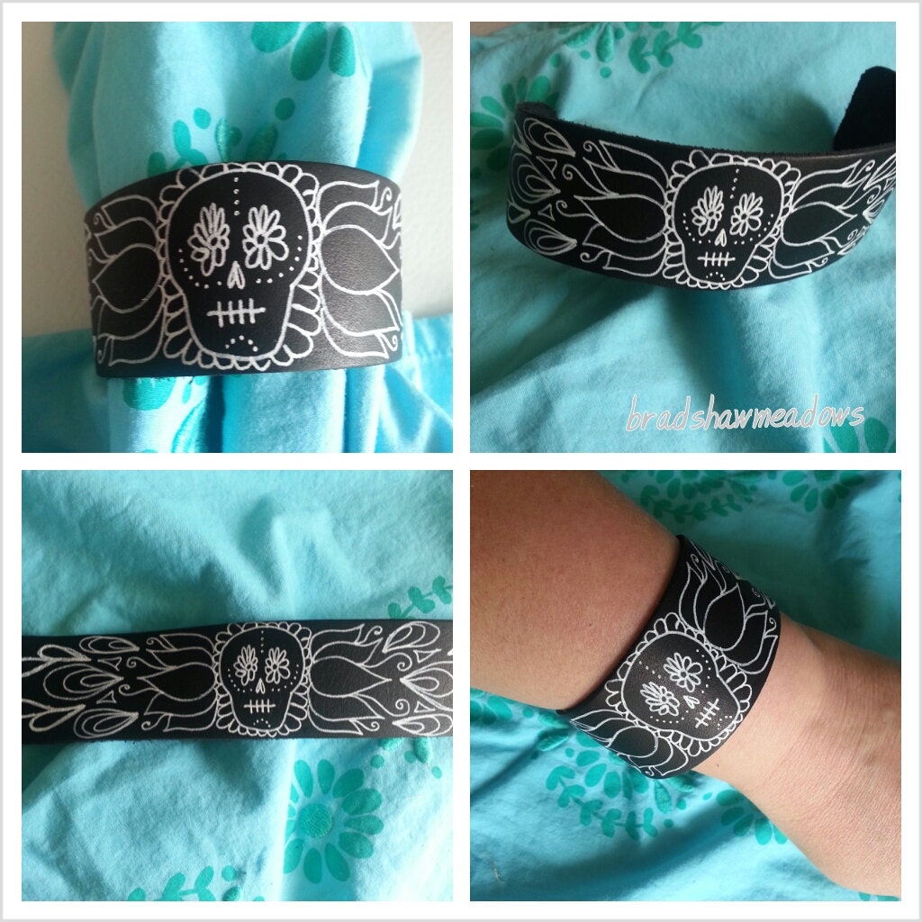 Black leather Cuff with Skull Designs in White