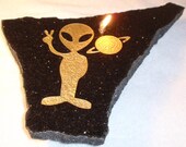 He is a  "Peaceful Alien" Firestone/Granite Oil Candle