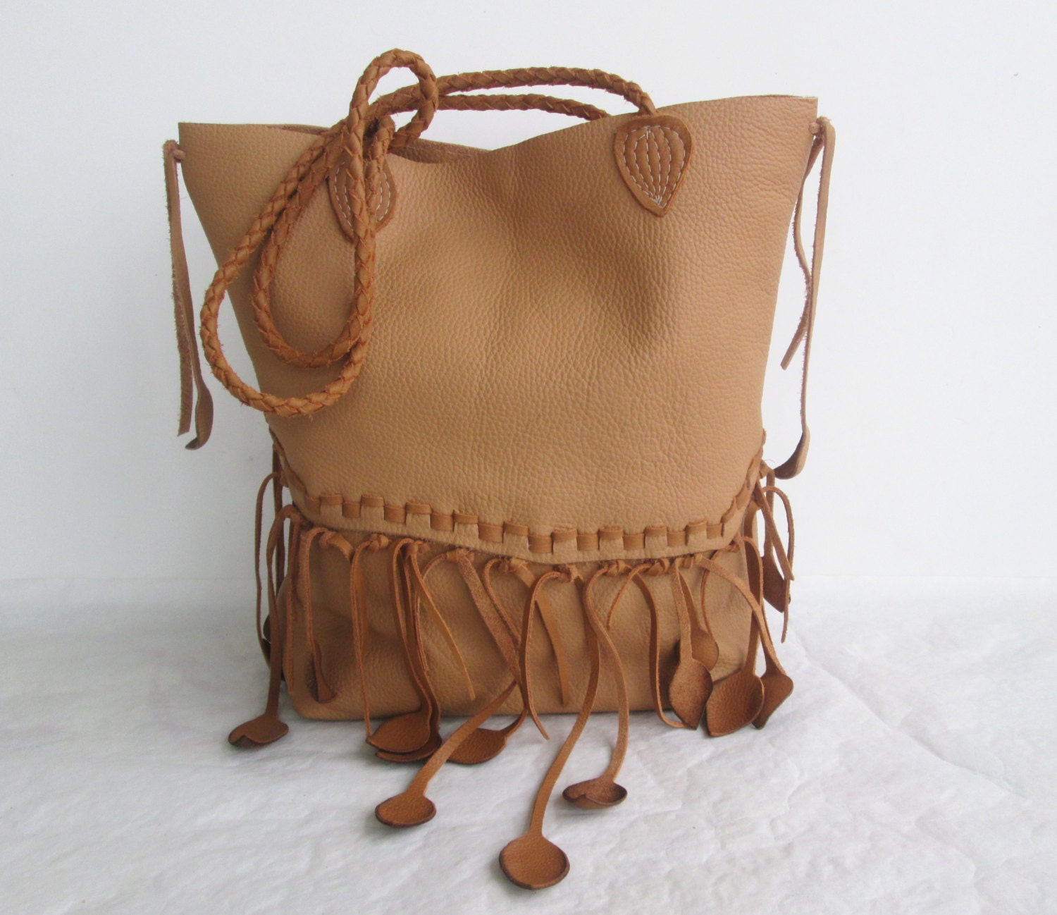 brown  tan leather  handbag tote with leaf fringe and braided strap by Tuscada. Ready to ship.