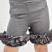Girls Ruffle Shorts in charcoal gray with silver polka dots