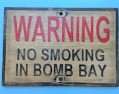 NO smoking in bomb-bay  sign made from reclaimed plywood