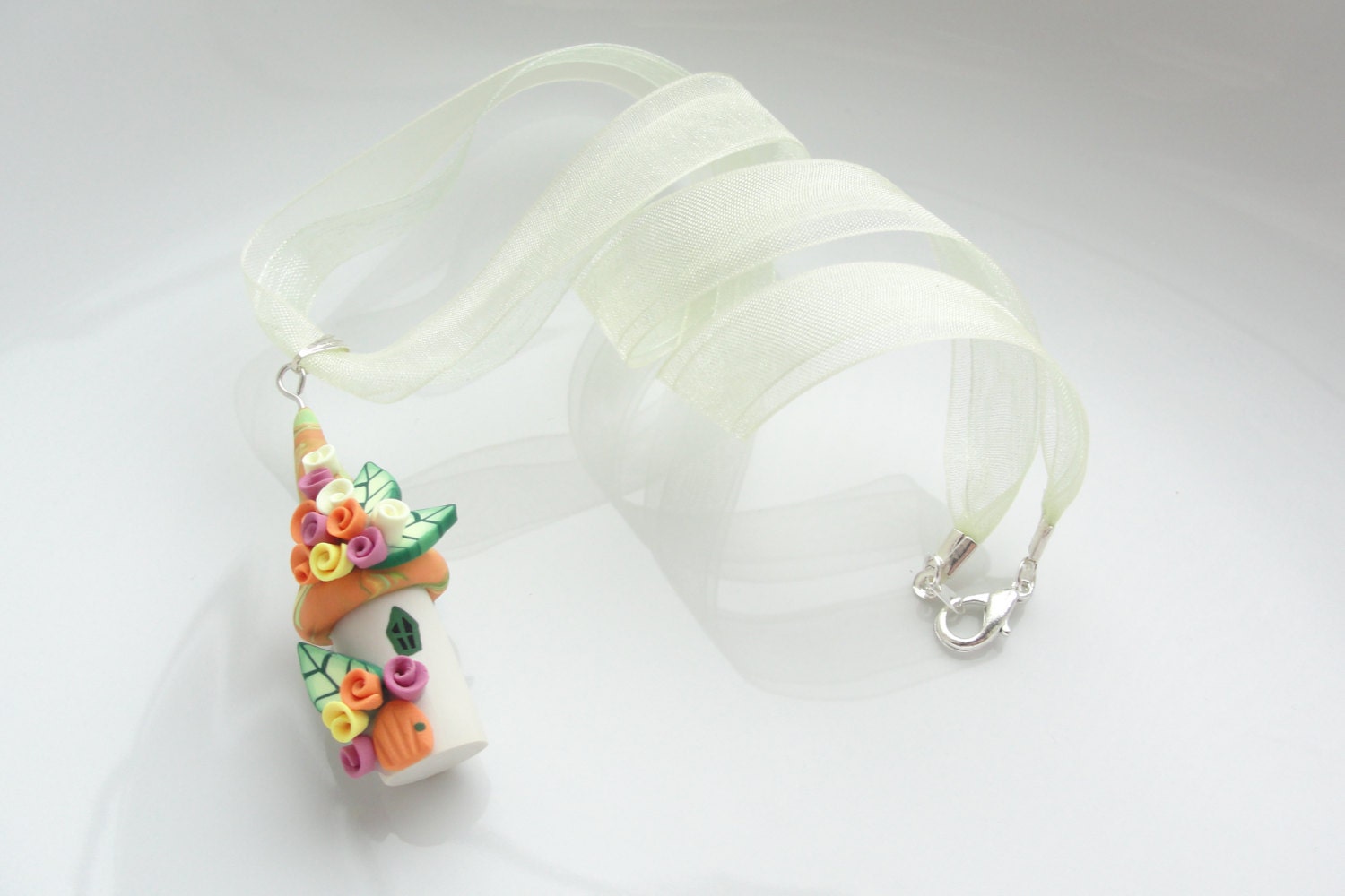 Polymer clay fairy house necklace in orange, yellow, pink and green