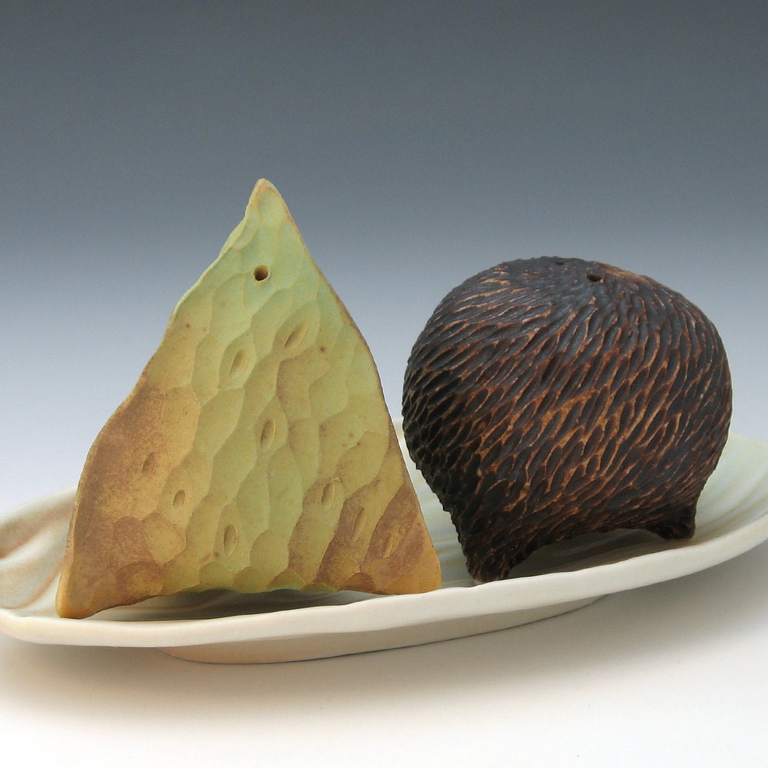 Hand carved porcelain brown salt & green pepper shakers with texture