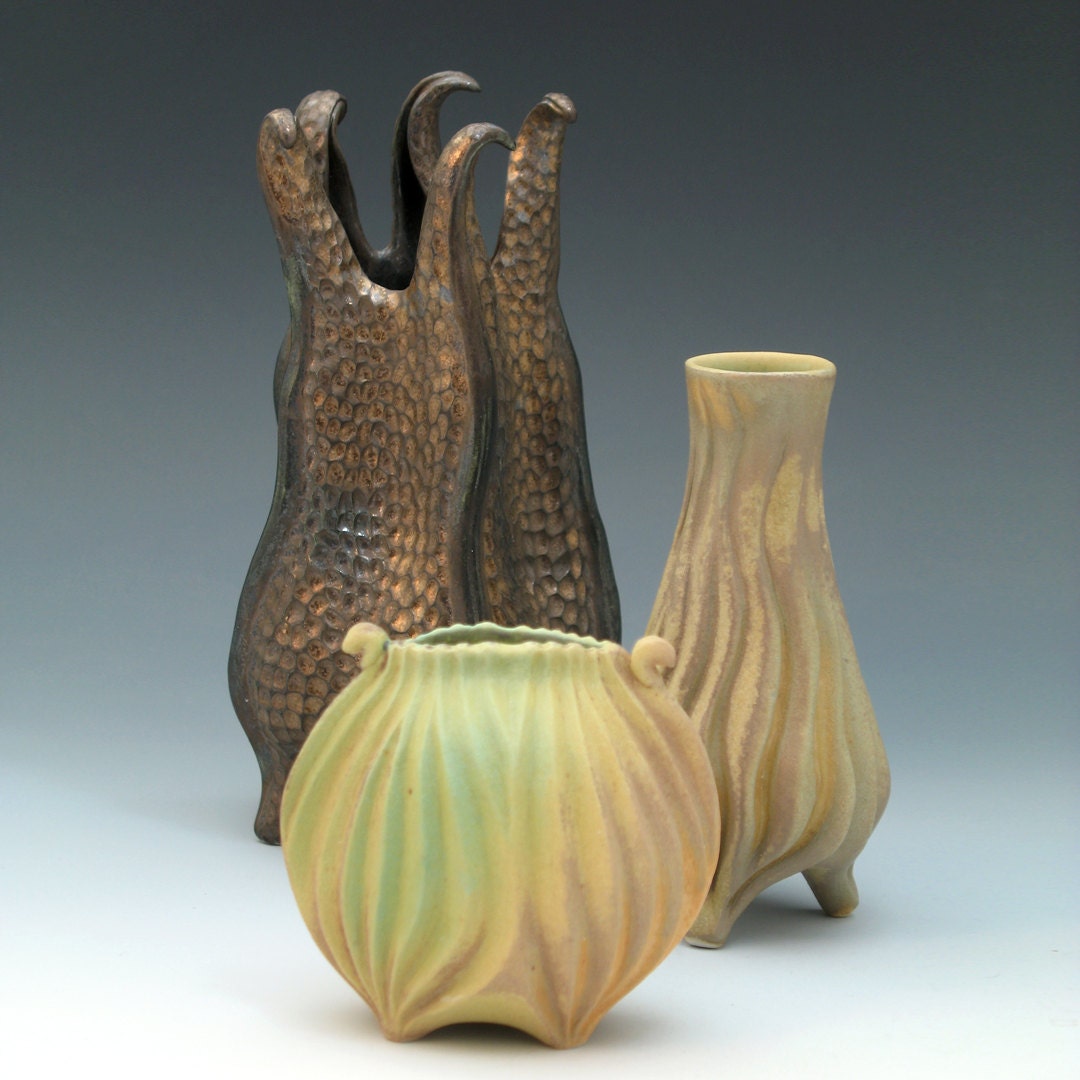 Oval porcelain vase in green & golden tan