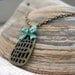 Bow and a Birdcage Necklace