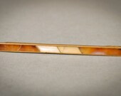 Vintage brass tie bar clip with glass.