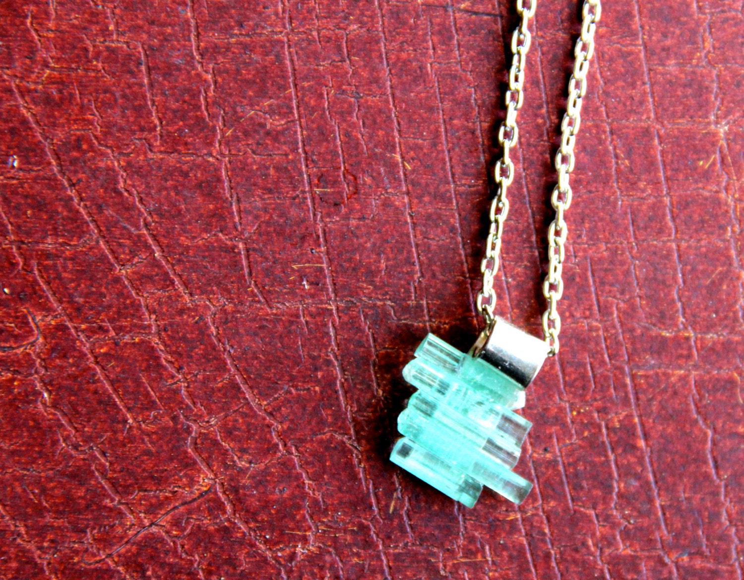green tourmaline rods on silver plant pendant necklace