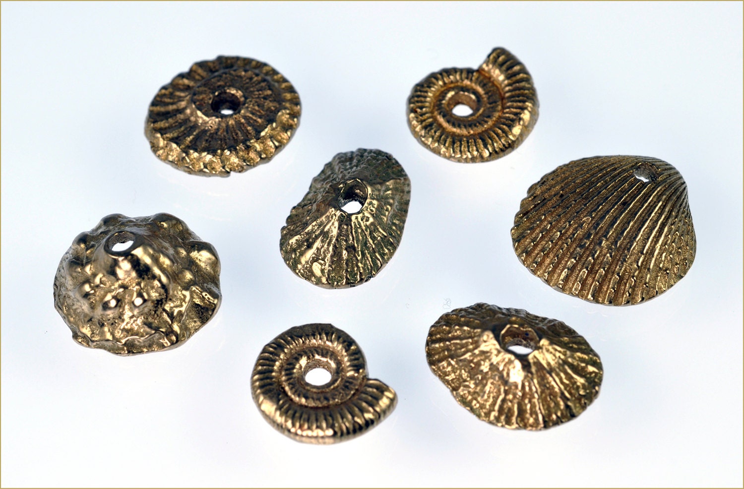 A Collection of Bronze Metal Clay Seashell Embellishments
