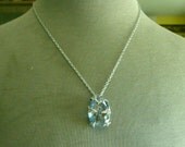 Faux Sapphire pendant in decorative filligree