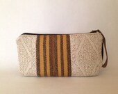 ZIPPER CLUTCH from upcycled upholstery swatches - fabric and leather