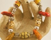 Bracelet with Tribal Porcelain Beads, Large Magnesite Dangles and Carved Bone.  Not for the Timid.
