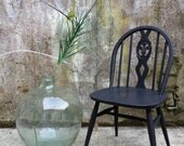 Painted carved Ercol kitchen chair in black