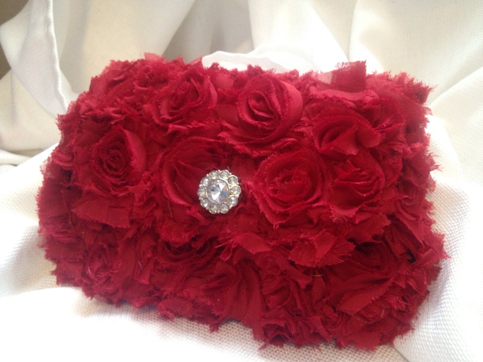 Red clutch with rosette detail