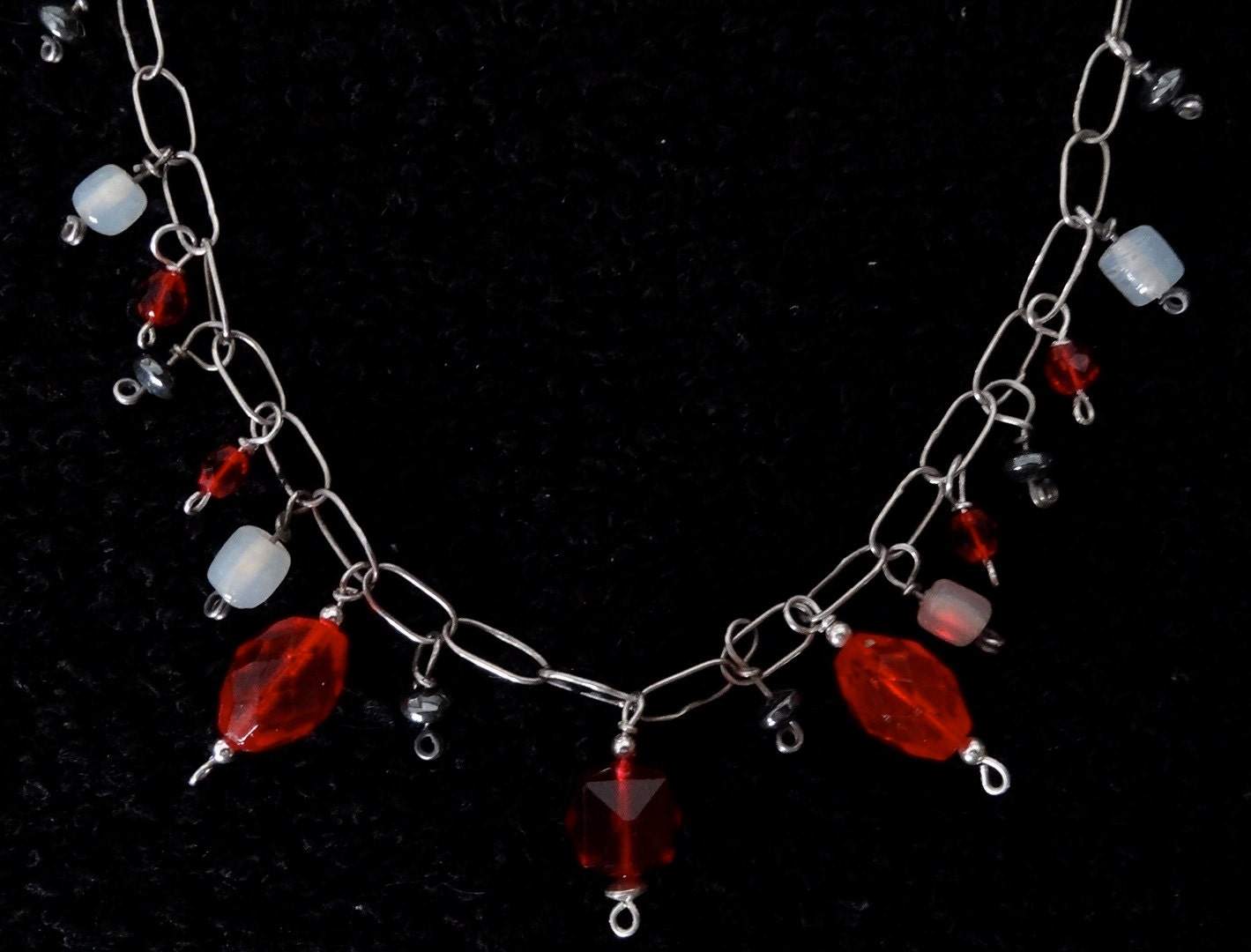 Sparkly necklace with red, white and black glass and stone beads